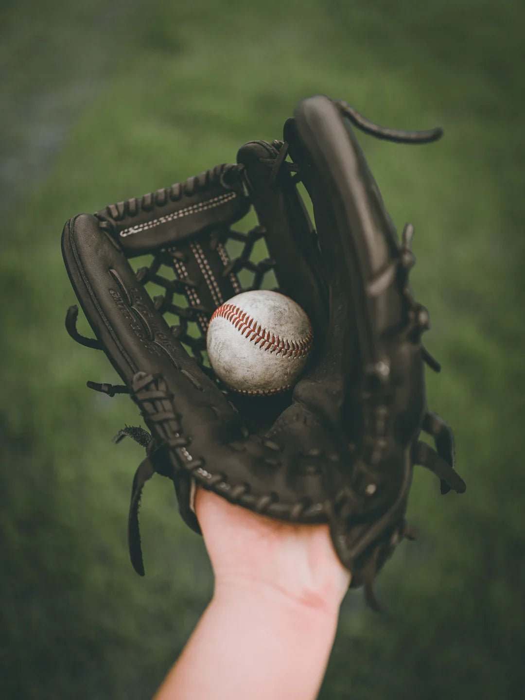 Baseball glove catching a ball symbolizing energy metabolism in sports fueled by carbohydrates
