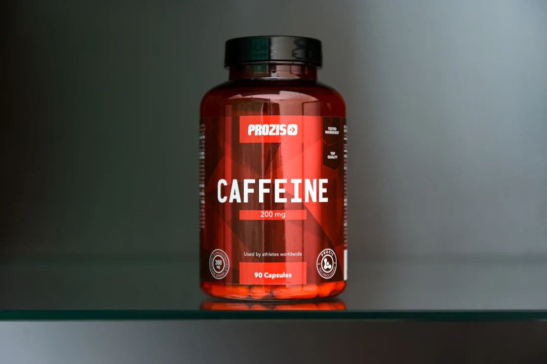 Bottle of Prozis caffeine capsules with 200mg dosage, 90 capsules, promoting sport nutrition basics.
